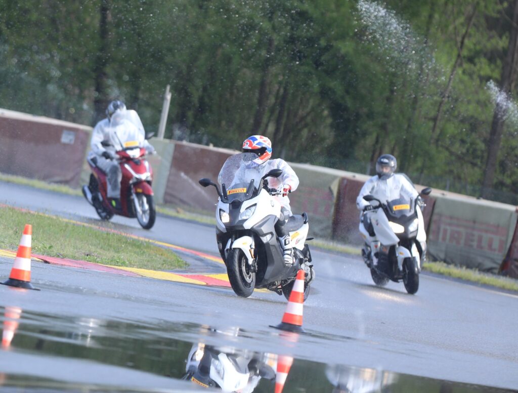 Scootertime’s editor‑in‑chief testing on wet conditions at the Pirelli Ticino Vizzola proving ground.