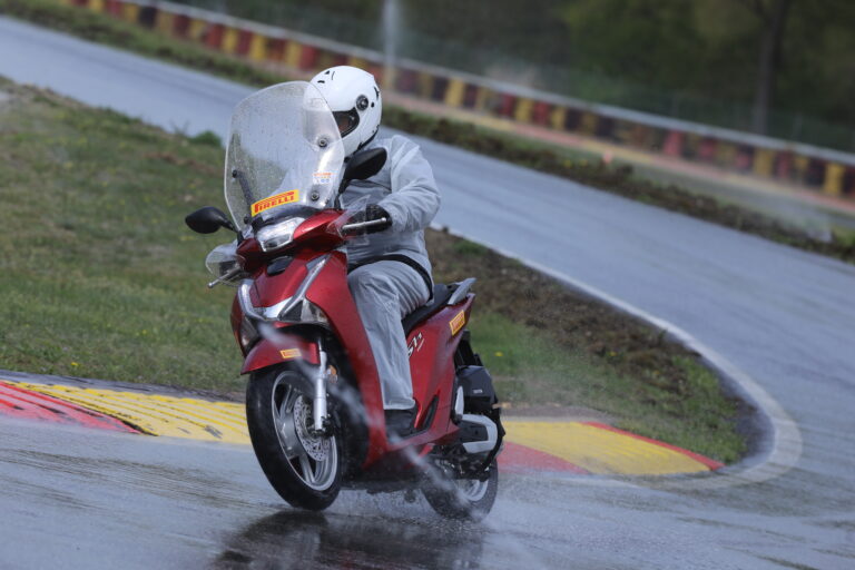 Scootertime’s editor‑in‑chief testing on wet conditions at the Pirelli Ticino Vizzola proving ground