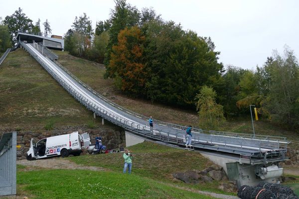 Schachermayr hoists a Vespa up a ski jumping hill.